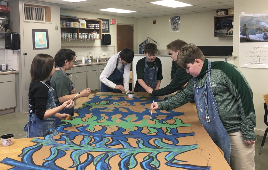 6th Grade Art class working on stage props for upcoming production of “The Wizard of Oz”.